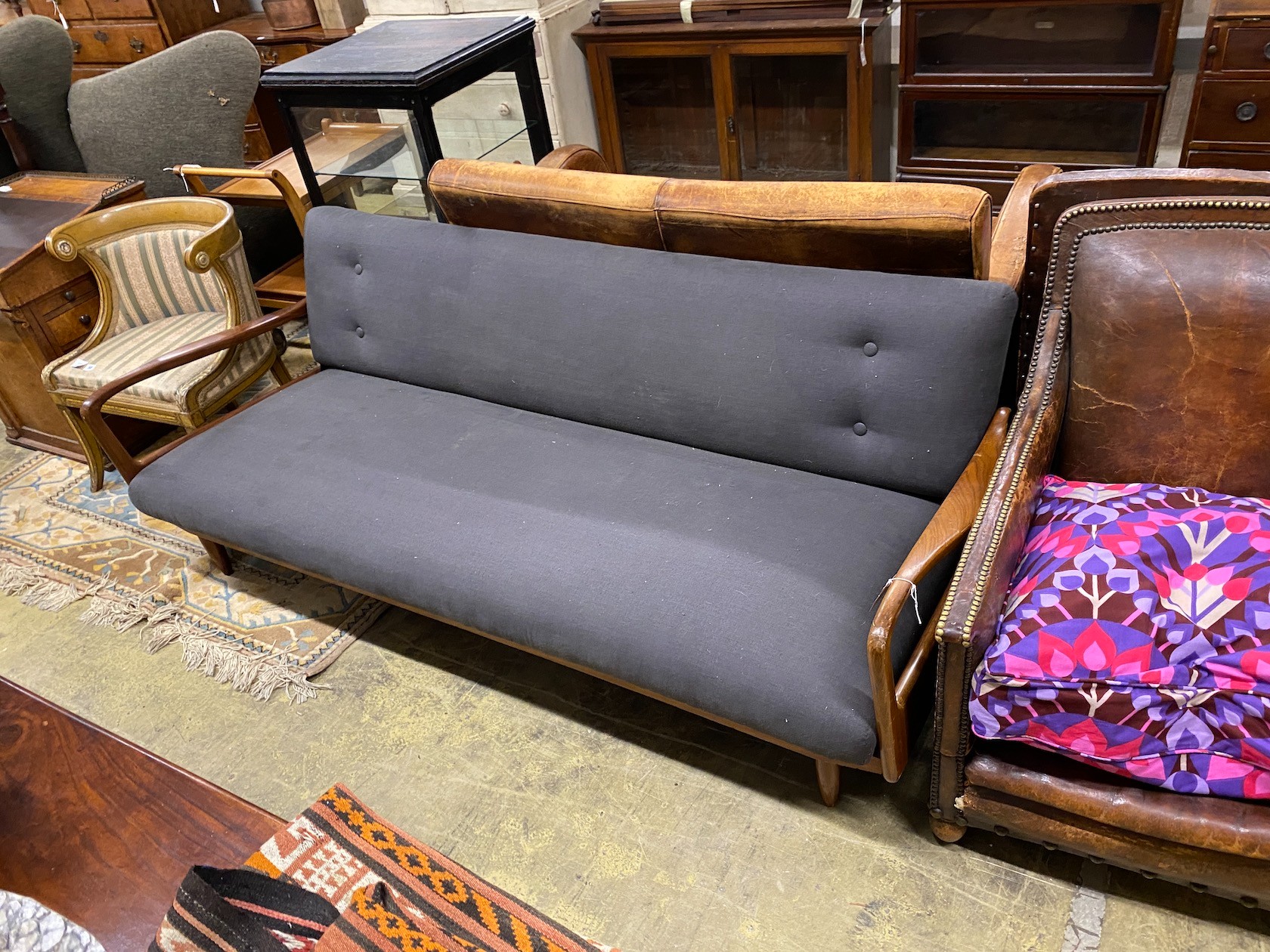 A Greaves & Thomas mid century teak sofa bed, length 198cm, width 76cm, height 71cm